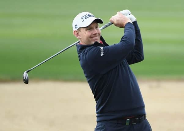Stephen Gallache plays his second shot on the par five 10th hole during the second round of the Omega Dubai Desert Classic at Emirates Golf Club. Picture: Ross Kinnaird/Getty Images