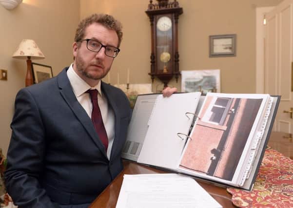 Tony Woolley with some of his documents showing the security/surveillance cameras. Picture:

 Neil Hanna