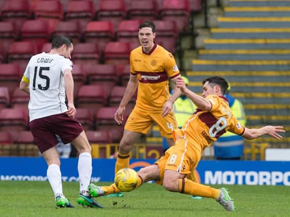 Carl McHugh was red carded for this challenge on Hearts' Don Cowie at Fir Park