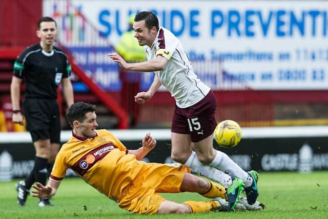 Carl McHugh was shown a red card in the 53rd minute for this challenge on Don Cowie