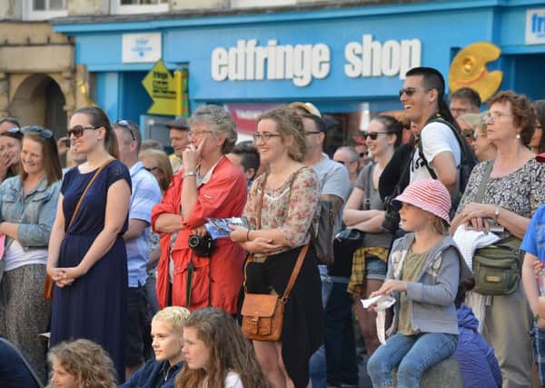 Crowds enjoying the Fringe entertainment on offer in the High Street. Picture: Jon Savage