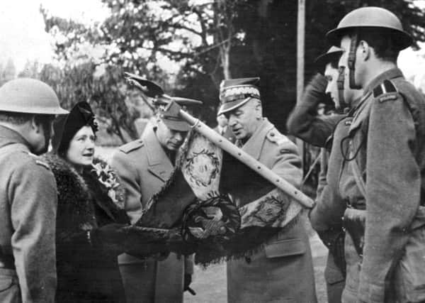The King and Queen with General Sikorski presenting colours to Polish Regiment at Dalkeith