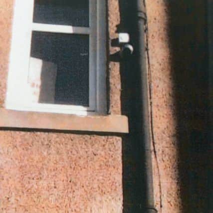 Cameras and microphones (white boxes) can be seen on the drainpipe behind. Picture:

 Neil Hanna