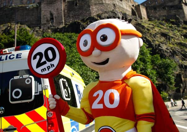 The city councils speed limit superhero, The Reducer, gets the 20mph message across. Picture: Scott Louden