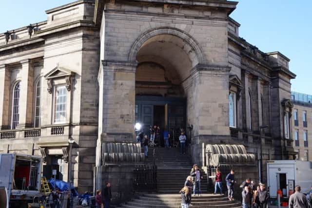 Film crews are becoming a common sight in Edinburgh
, as seen her for the filming 'Churchill' at St. Stephen's church