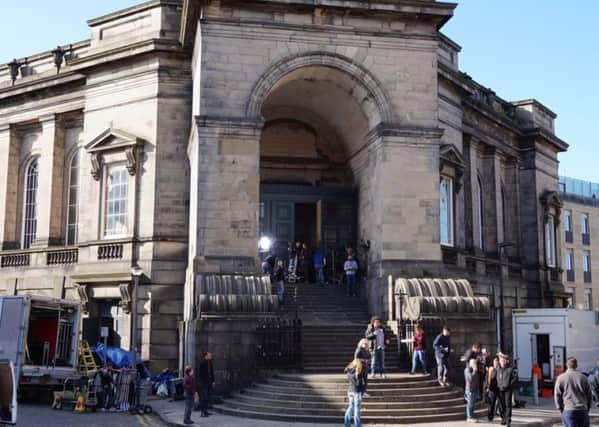 Film crews are becoming a common sight in Edinburgh
, as seen her for the filming 'Churchill' at St. Stephen's church