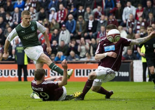 Ross Caldwell strikes home his late winner against Hearts at Tynecastle