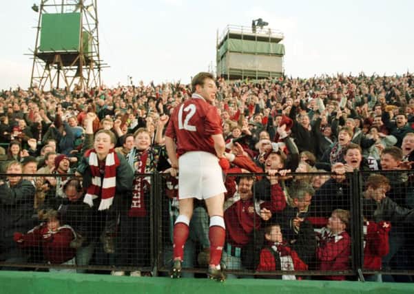Wayne Foster celebrates with the Hearts fans