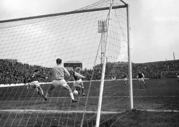 Hibs v Hearts at Easter Road in May 1965 in the Summer Cup. Hearts keeper Jim Cruickshank stops a shot from Hibs' Peter Cormack.
Hibs won 3-0