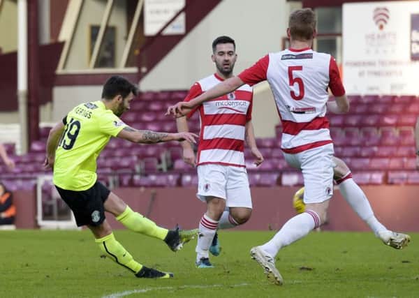 James Keatings fires home his goal. He scored a second in the second half