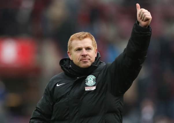 Hibs boss Neil Lennon salutes the travelling fans. Picture: Ian MacNicol/Getty Images