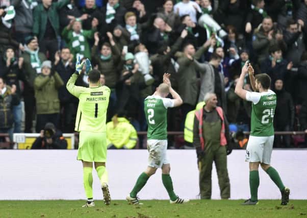 Ofir 
Marciano leads his team-mates in applauding the Hibs supporters in the Roseburn Stand after securing a replay a week tomorrow at Easter Road