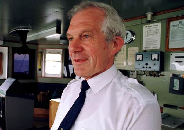 Captain of the Gardyloo Ronnie Leask in the wheel house