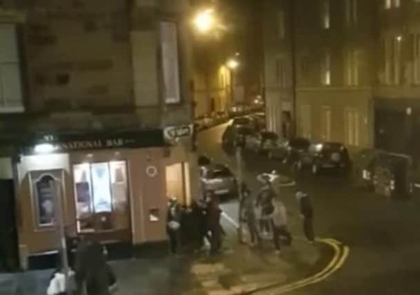 The fight appeared to have been sparked when one set of supporters try to get into the International Bar in the citys Brougham Place. Picture; Deadline