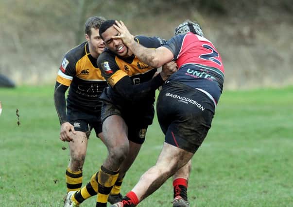 Ratu Tagive gets a hand in the face from Hawks player Grant Stewart. Picture: Lisa Ferguson