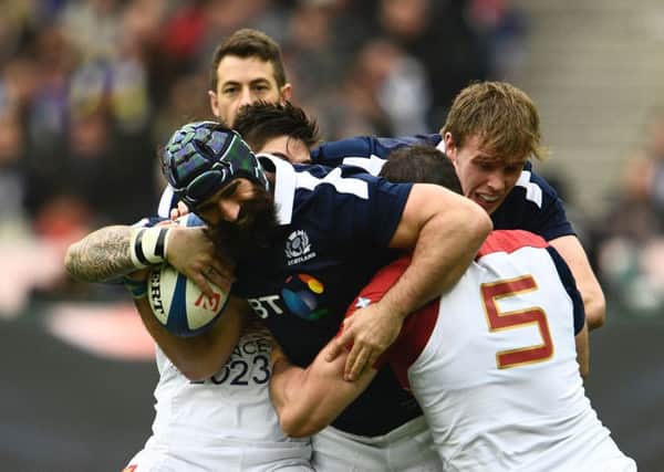 Scotland's number 8 Josh Strauss (L) holds the ball during the Six Nations international rugby union match between France and Scotland at the Stade de France in Saint-Denis, on February 12, 2017. / AFP PHOTO / Martin BUREAUMARTIN BUREAU/AFP/Getty Images