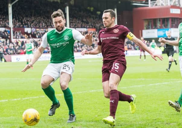 Don Cowie was challenged by Hibs opponent Darren McGregor at Tynecastle. Pic: Ian Georgeson