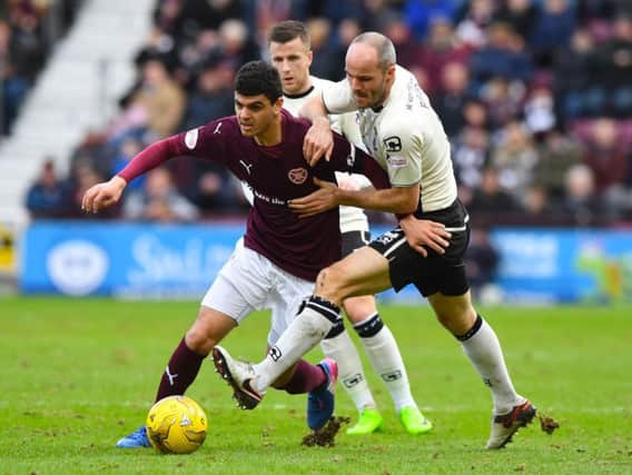 Choulay tries to evade Inverness defender David Raven on his first Hearts start