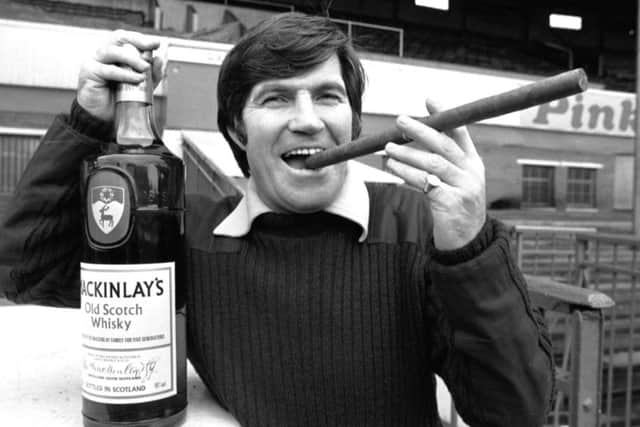 Bertie Auld enjoys a light moment at Easter Road. The Hibs players also felt his wrath at times