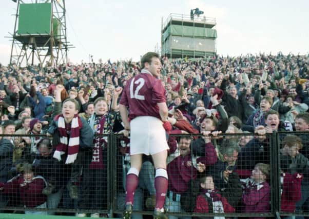 Wayne Foster celebrates his winning goal for Hearts at Easter Road in February 1994