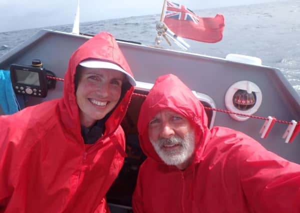 Fenella McAlister and Martin Cruickshank on-board the rowing boat in the Atlantic. Picture; SWNS