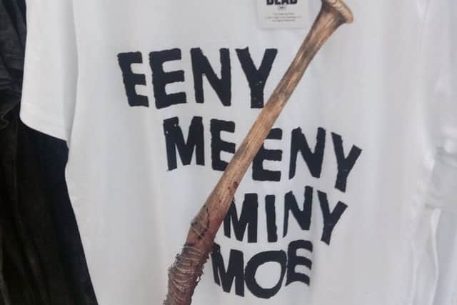 Primark has removed a t-shirt promoting hit US TV show The Walking Dead after it was branded "fantastically offensive" and "racist"