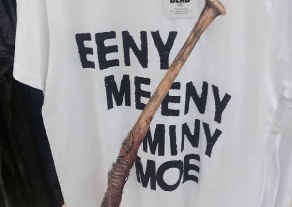 Primark has removed a t-shirt promoting hit US TV show The Walking Dead after it was branded "fantastically offensive" and "racist"