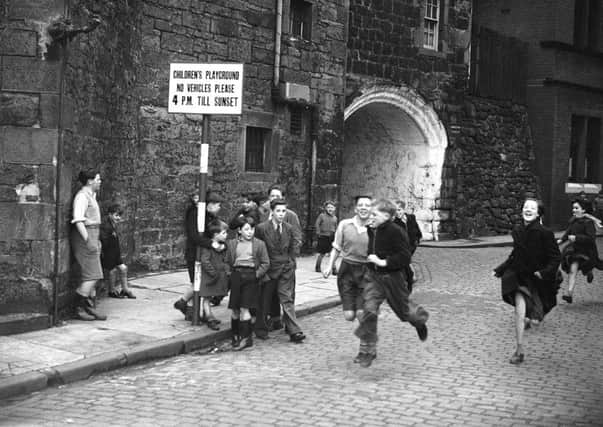 Children running on Johnston Street, Leith. Picture: TSPL
