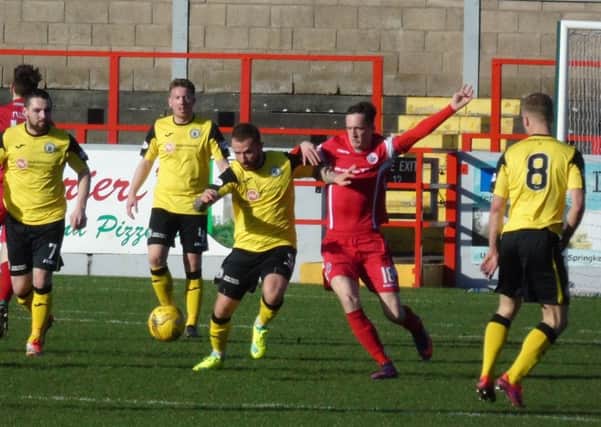 Edinburgh City's Josh Walker battles for possession against Stirling Albion: Pic: Alex Drysdale