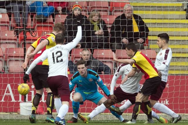 Kris Doolan scores the opening goal for Partick against Hearts