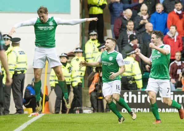 Grant Holt celebrates his goal with Darren McGregor and John McGinn. Picture: Ian Georgeson