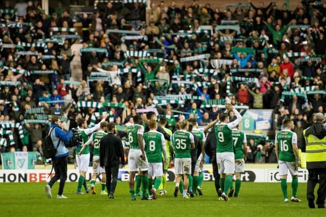 Hibs players and fans celebrate victory in this week's derby. Picture: Ian Georgeson