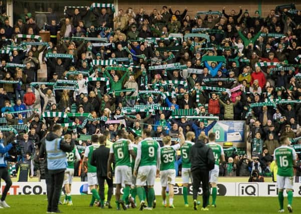 Hibs fans celebrate at the end of the game. Picture; Ian Georgeson