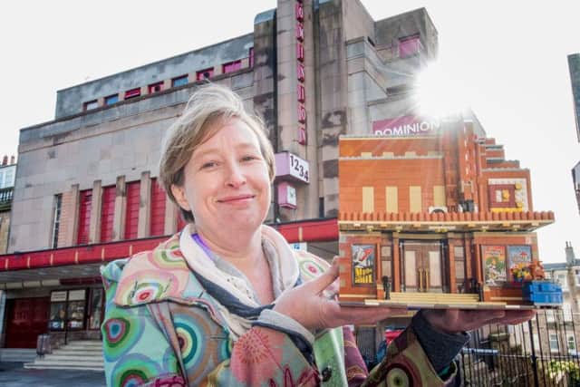 Tammy Watchorn with her Dominion Cinema replica made out of Lego. Picture: Ian Georgeson.