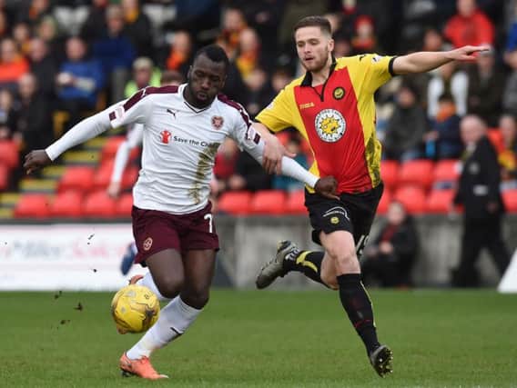 Hearts striker Esmael Goncalves challenges Daniel Devine before his red card at Firhill