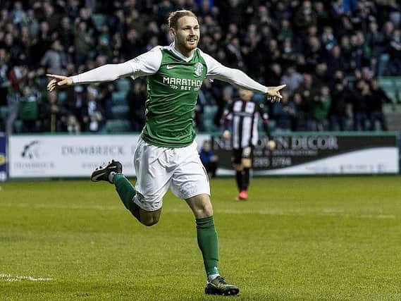 Martin Boyle turns away in celebration after opening the scoring for Hibs against Dunfermline at Easter Road