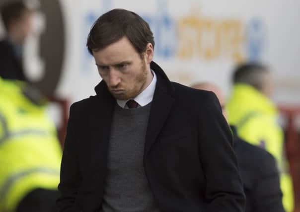 Ian Cathro cuts a dejected figure at full-time at Firhill