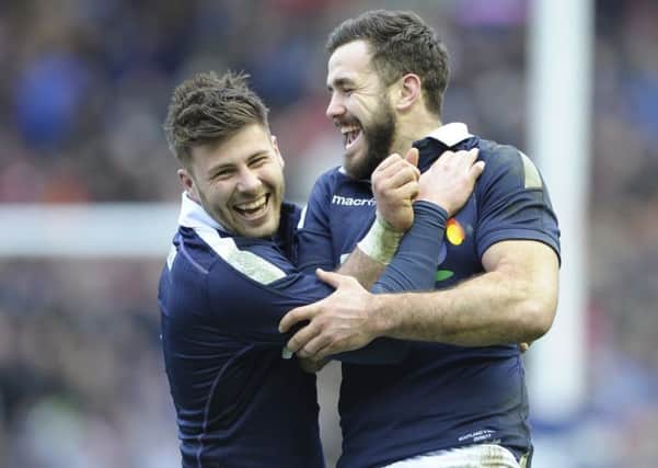 Ali Price and Alex Dunbar celebrate at BT Murrayfield after a thrilling defeat of Wales. Pic: Neil Hanna