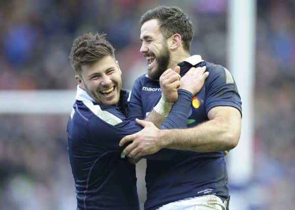Ali Price and Alex Dunbar celebrate Scotland's victory over Wales. Picture: Neil Hanna