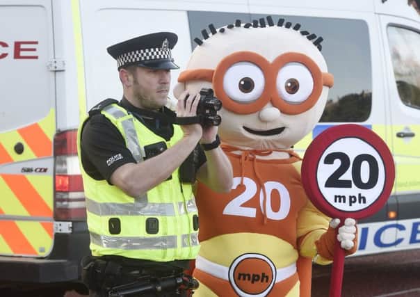 Edinburgh Council 20mph mascot with PC Ben Wray to launch the new zones on Tuesday.