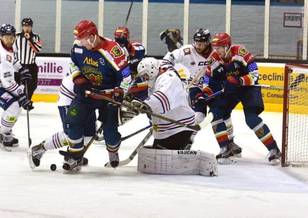 A full on attack by the capitals lead by Karel Hromas (on left of picture) and Jared Staal (at goalmouth)