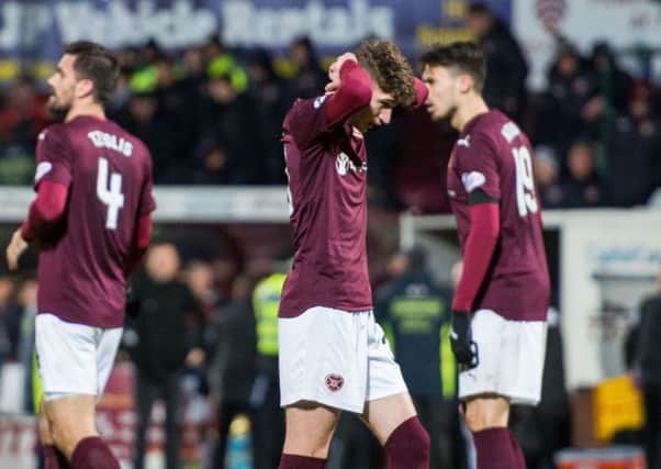 Hearts youngster Rory Currie sums up the feelings of the team and supporters after Ross County condemned them to defeat. Picture: Ian Georgeson