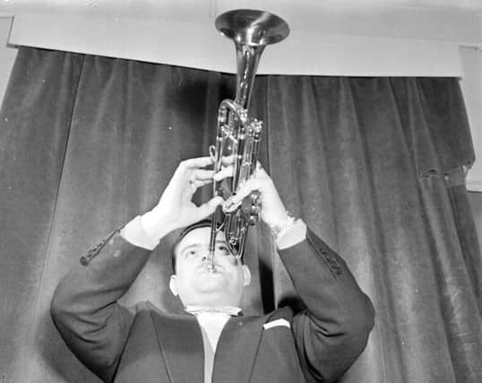 Eddie Calvert plays his trumpet backstage at the Empire Theatre Edinburgh in 1958