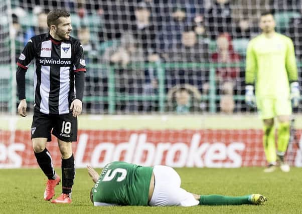 Liam Fontaine lies grounded after picking up an ankle injury against Dunfermline last weekend. Pic: SNS