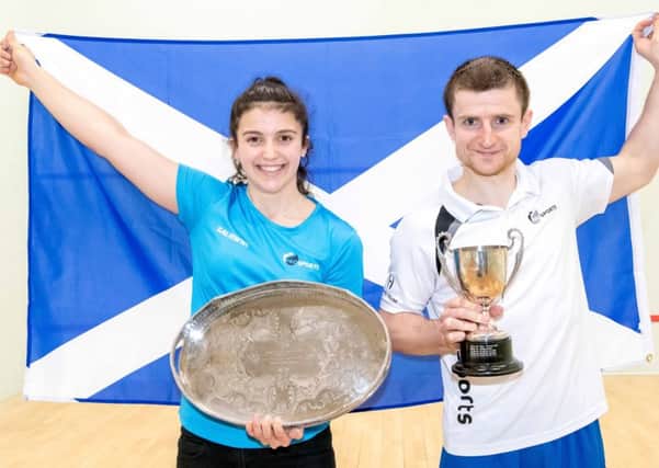 Georgia Adderley and Alan Clyne show off their trophies after winning titles at the Sterling Trucks Scottish Senior National Championships. Picture: Andy Weston