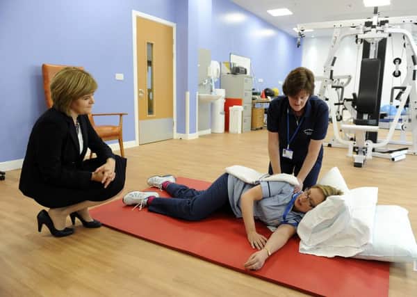 Nicola Sturgeon, health secretary opens the Midlothian Community Hospital, Bonnyrigg. Nicola in the excersie area with Carol Maguire and Amanda Stears, physiotherapists