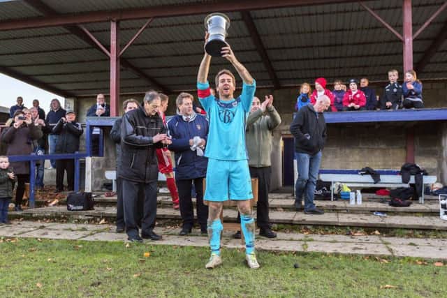 Iain Gordon lifts the Alex Jack Cup