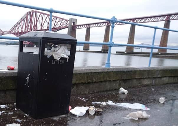 Overflowing communcal bins and uncollected rubbish on streets has been an issue in Edinburgh.