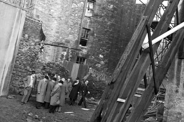 The collapsed Penny Tenement at Beaumont Place is visited by Dean of Guild Court officials. Picture: TSPL
