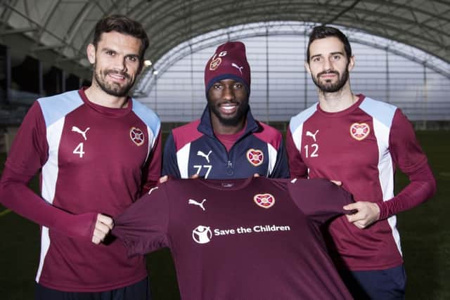 Three of Hearts' January signings: Esmael Goncalves, centre, with new team-mates Alex Tziolis, left, and Tasos Avlonitis